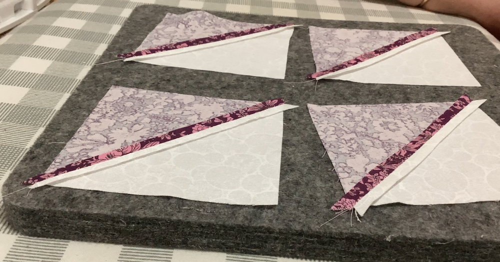 press the seams for each half square triangle open